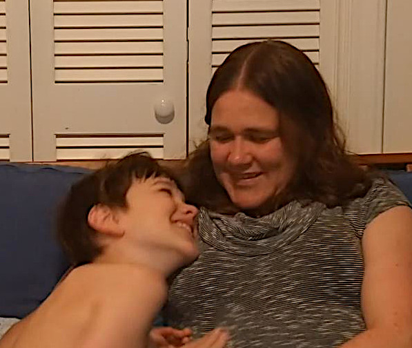 mother and son smiling